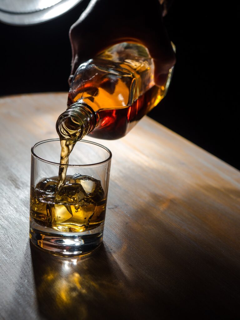 Pouring whisky into a glass